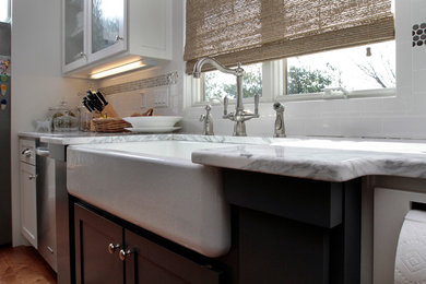 Kitchen - traditional u-shaped kitchen idea in Louisville with a farmhouse sink, shaker cabinets and blue cabinets