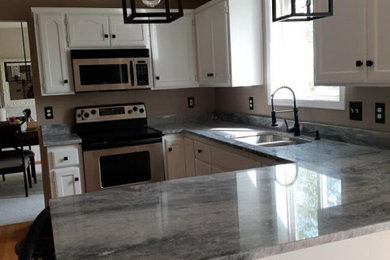 Example of a minimalist kitchen design in Other