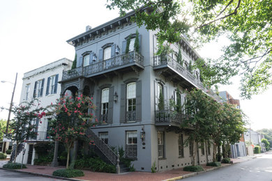 Design ideas for a mid-sized traditional three-storey stucco grey exterior in Atlanta.