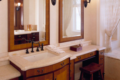 Large elegant master bathroom photo in Seattle with white walls, medium tone wood cabinets and an undermount sink