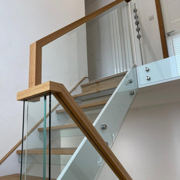 Oak & White Staircase with Structural Glass