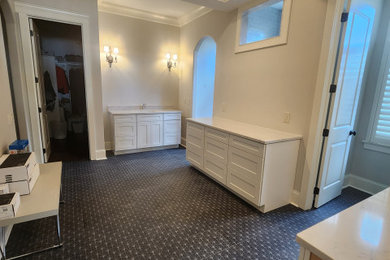 Bathroom - large contemporary master bathroom idea in Charlotte with quartzite countertops and a freestanding vanity
