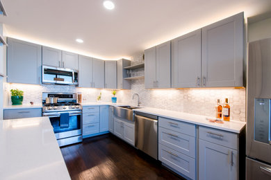 Mid-sized trendy galley dark wood floor and brown floor eat-in kitchen photo in DC Metro with an undermount sink, shaker cabinets, gray cabinets, quartz countertops, gray backsplash, marble backsplash, stainless steel appliances, no island and white countertops