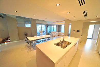 Contemporary galley eat-in kitchen in Perth with with island.
