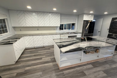 Mid-sized trendy kitchen photo in Seattle with an undermount sink, flat-panel cabinets and an island