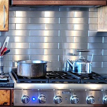 Koa Wood Cabinets with Stainless Steel Backsplash in Hawi Hawaii