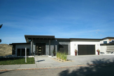Mid-sized minimalist gray two-story mixed siding flat roof photo in Boise