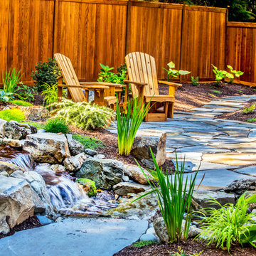 Flagstone next to small waterfall