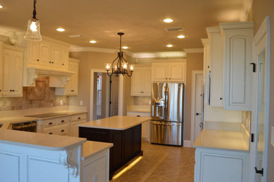 Example of a kitchen design in Miami with an island