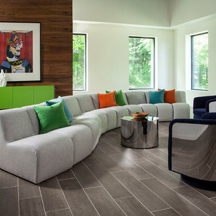 Living room - midcentury modern open concept gray floor living room idea in Other with white walls