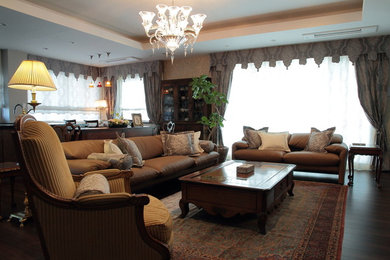 Inspiration for a timeless medium tone wood floor living room remodel in Fukuoka with white walls