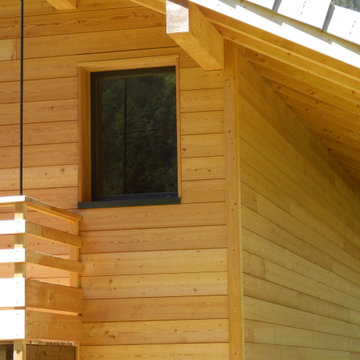 Maison ossature bois en bardage mélèze
