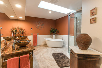 Photo of a large transitional master bathroom in Seattle with a freestanding tub, a corner shower, beige tile, porcelain tile, orange walls, porcelain floors, a vessel sink and engineered quartz benchtops.