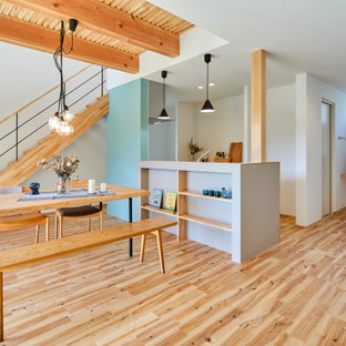 Great room - scandinavian medium tone wood floor, wallpaper ceiling and wallpaper great room idea in Other with gray walls