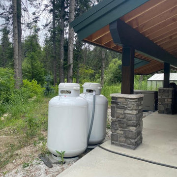 Commissioned Propane Tanks Disguise to match house rocks
