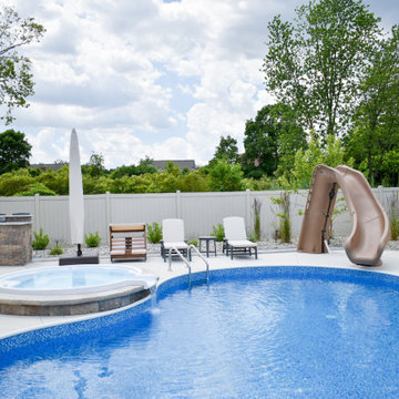 Outdoor Kitchen With Bar Seating + Landscaping