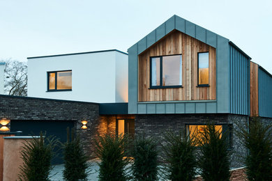 Large and white contemporary two floor detached house in Devon with metal cladding.