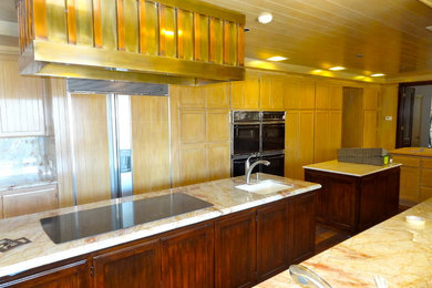 Inspiration for a huge modern galley kitchen pantry remodel in Other with an undermount sink, shaker cabinets, light wood cabinets, multicolored backsplash, porcelain backsplash, black appliances and two islands
