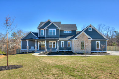 Large craftsman blue two-story wood gable roof idea in Atlanta