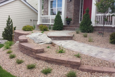 Design ideas for a large traditional full sun front yard concrete paver landscaping in Denver for summer.
