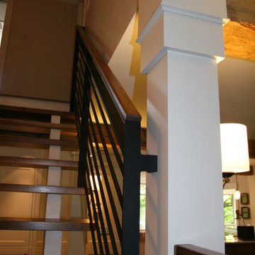 Open concept contemporary stairs with steal railing