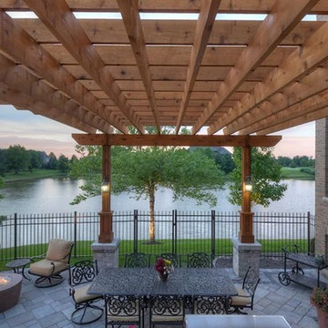 Cobblestone Landscape Renovation with Paver Pool Deck, Pergola, Outdoor Kitchen