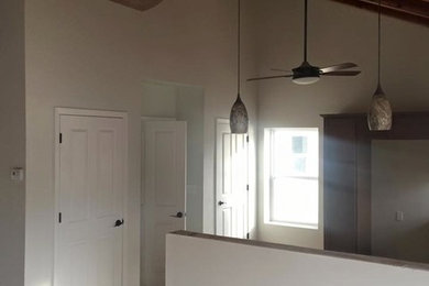 Example of a mid-sized classic open concept limestone floor and beige floor living room design in Other with no tv