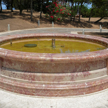 round water fountain in sicilian rose marble