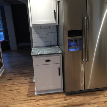cabinet refacing-- white with soapstone countertops and subway tile backsplash