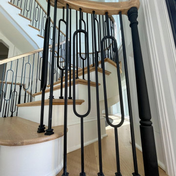 Project #95 | Freestanding Elliptical Staircase with Geometric Iron Balusters