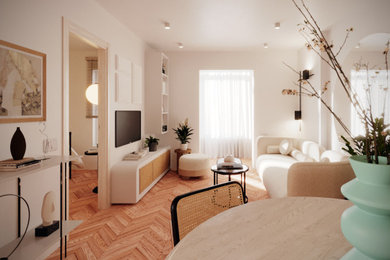 Small danish open concept medium tone wood floor and brown floor living room photo in Madrid with white walls and a wall-mounted tv