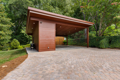 Large mid-century modern two-car carport photo in Other