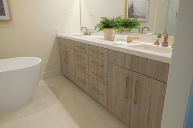 This is an example of a modern bathroom in Sacramento with a japanese tub, beige walls, beige floor, white benchtops, a double vanity and shaker cabinets.