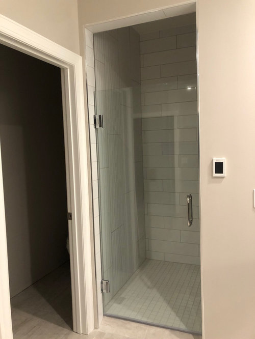 shower door hits the wall.