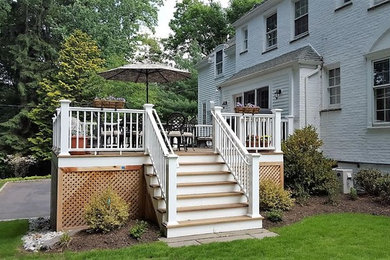 Deck - mid-sized traditional backyard deck idea in New York with no cover