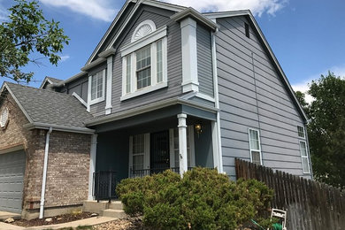 Inspiration for a timeless gray house exterior remodel in Denver