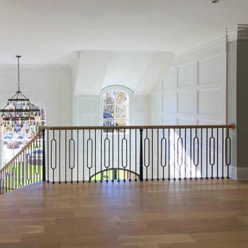 Project #95 | Freestanding Elliptical Staircase with Geometric Iron Balusters