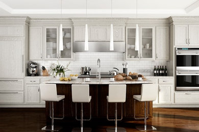Mid-sized transitional galley dark wood floor eat-in kitchen photo in Seattle with an undermount sink, shaker cabinets, gray cabinets, marble countertops, white backsplash, subway tile backsplash, stainless steel appliances and an island