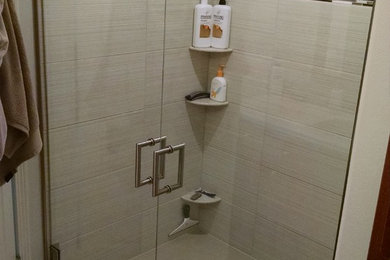 Example of a master white tile alcove shower design in Other with an undermount sink and quartz countertops