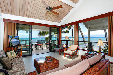 Example of an island style living room design in Orange County