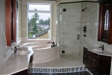 Example of a bathroom design in Vancouver with dark wood cabinets