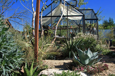 Inspiration for a large traditional backyard full sun xeriscape in Portland with gravel.
