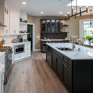 3 Finishes on Kitchen Cabinetry with Galley Workstation in Island and Wine Bar