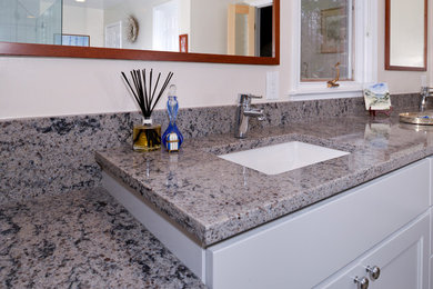 Large elegant master bathroom photo in DC Metro with white cabinets and granite countertops