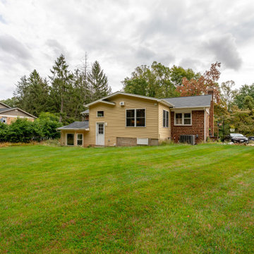 Cheerful Multi Level Rear Addition to Expand Kitchen, Mudroom & Sunroom in Oakt