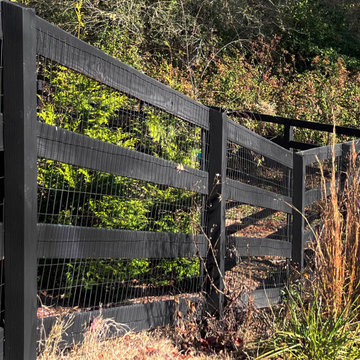 Black four rail gate with wire