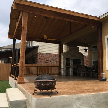 Gable Cover with Decorative Concrete Patio and Stone Grill/Fireplace