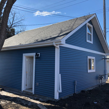 Yard Side of two story custom garage with Stairs