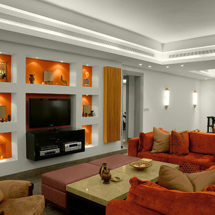 Foto de sala de estar tipo loft, actual, con parades naranjas