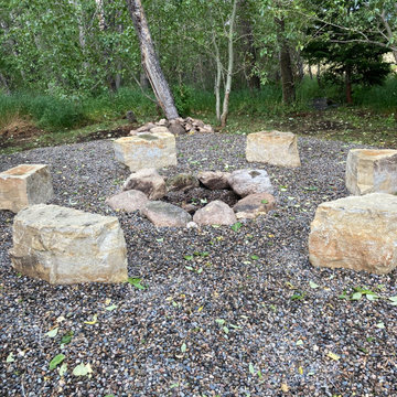 Fire Pit Area w/ Silt Sandstone Block Rock as seating & moss rock boulders as fi